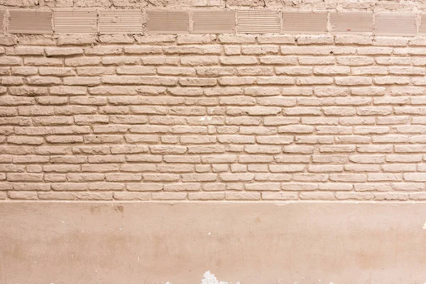 Texture brick wall of beige color