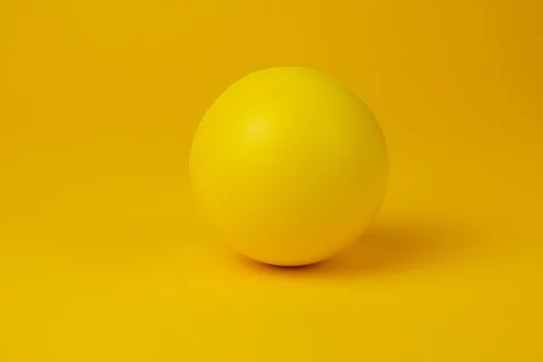 Yellow Glossy Game Ball Close Yellow Background — Stock Photo, Image