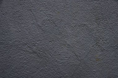 Düz olmayan yüzeyin dokusu kül renginde. Buruşuk yüzey