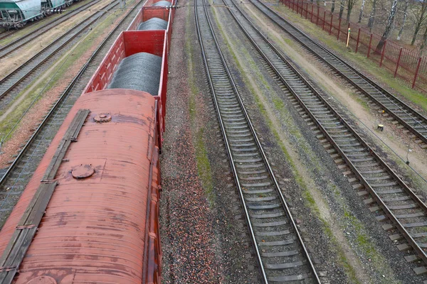 Filled wagons on the railway tracks. Wagons.