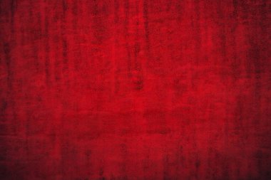 Texture of dark red festive background. Dark red background with dimming.