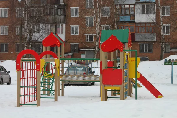 Children\'s town in the yard in winter in the snow
