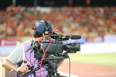 Yumuşak odak ve bulanık profesyonel kameraman ve Video kamera