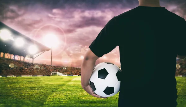 Football player holding ball on football stadium of championship — Stock Photo, Image