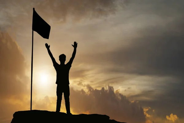 Silhouette of man show arm up for achievements successful and ce — Stock Photo, Image