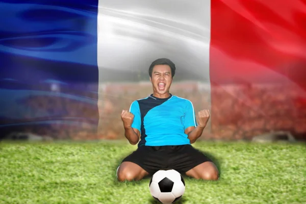 soccer football player young man happiness joy kneeling and socc