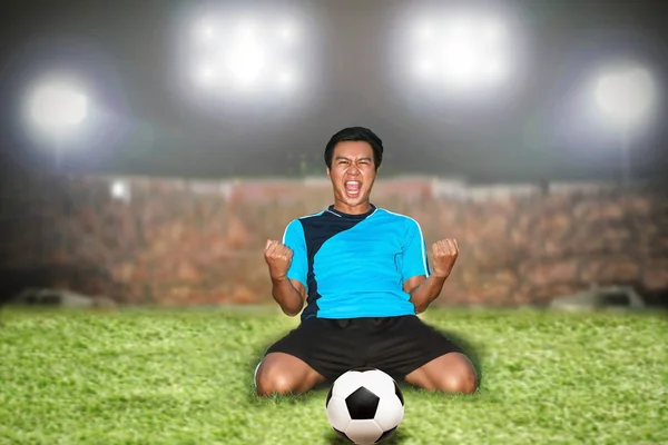 Soccer football player young man happiness joy kneeling and socc — Stock Photo, Image