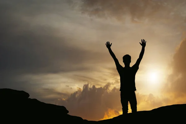 Silhouette of man show arm up for achievements successful and ce — Stock Photo, Image