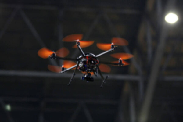 blurry flying drone with camera on the night