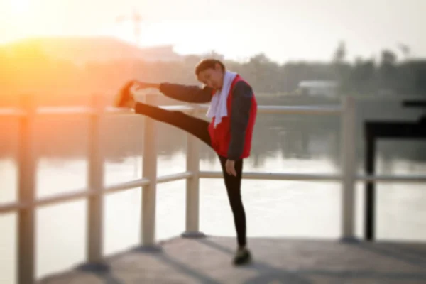 Blurry of Athletic woman asia warming up and Young female athlet — Stock Photo, Image