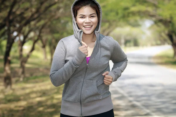 Running woman. Female runner jogging during outdoor on road .You — Stock Photo, Image