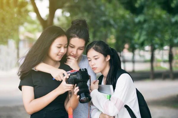 Asian women group tourists looking at camera's monitor checking — Stock Photo, Image