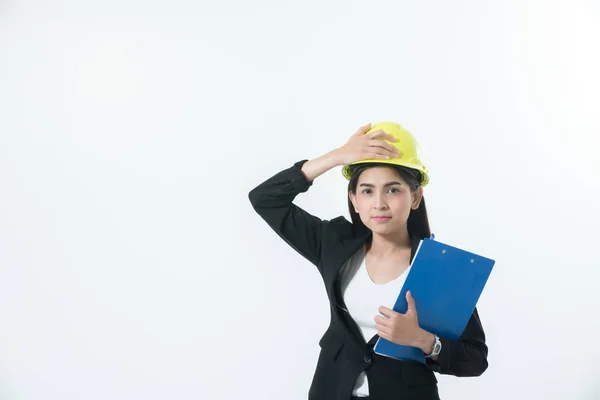 Asiatische Ingenieurinnen inspizieren und arbeiten und halten blau — Stockfoto