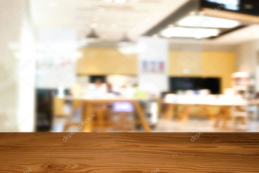 Empty top of wooden table or counter on Abstract Blurry of peopl
