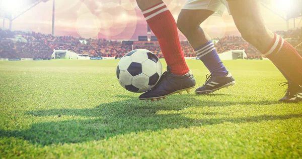 Soccer or football player standing with ball on the field for Ki — Stock Photo, Image