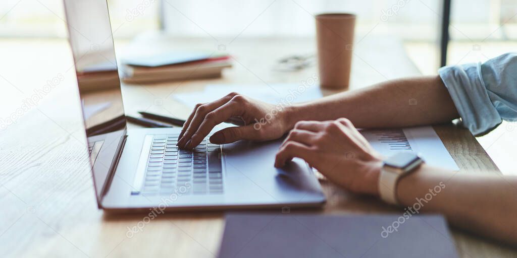 Female hands working on modern laptop