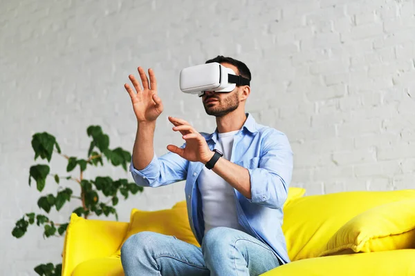 Man with virtual reality headset 3d glasses playing and catching something — Stockfoto