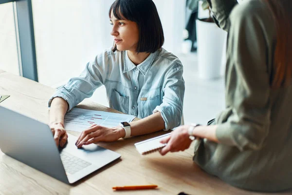 Closeup of two young woman working, having meeting, discussing, using laptop. Unhappy face concept — Stockfoto