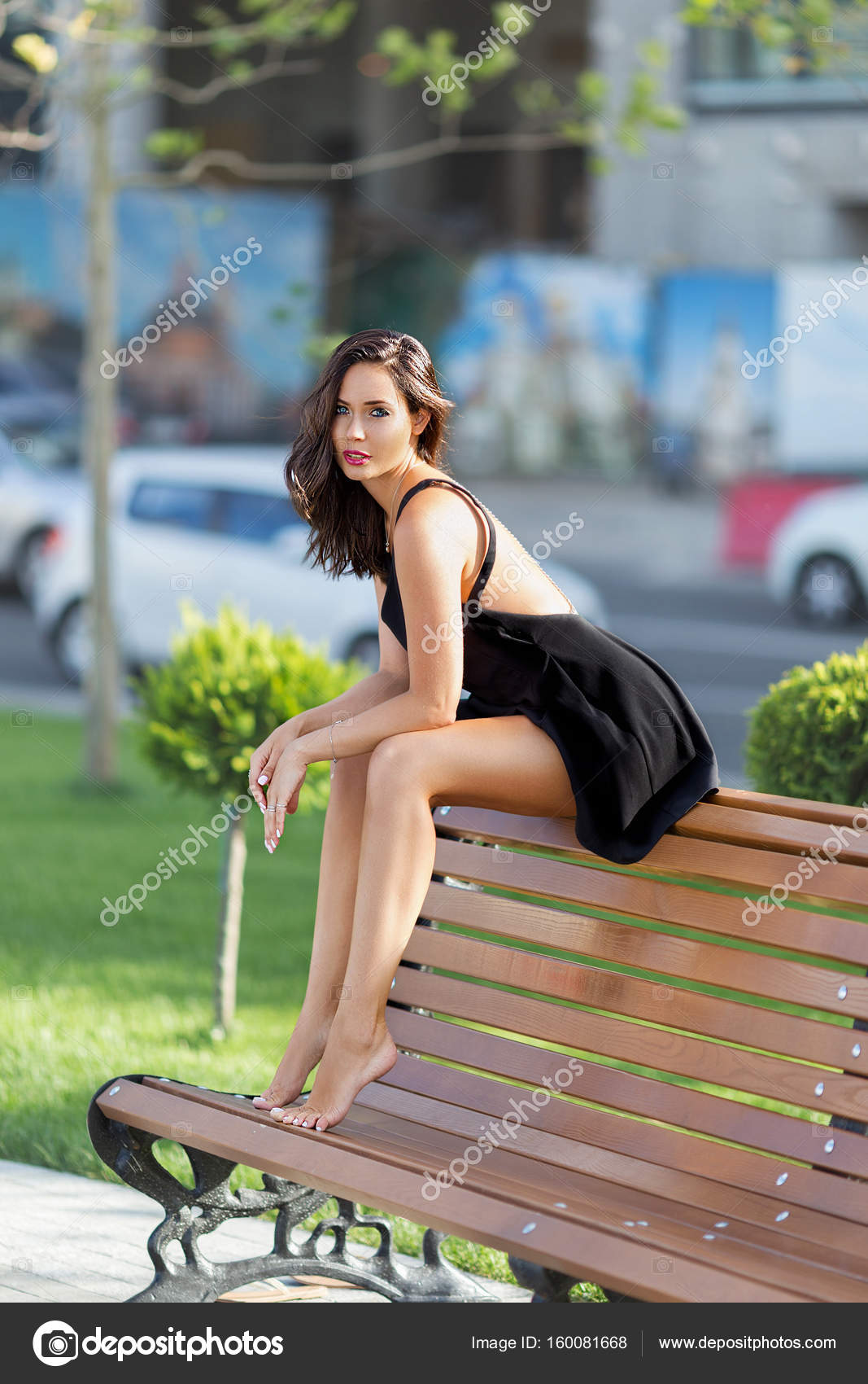 Girl Sitting on Giant Chair Stock Image - Image of barefeet