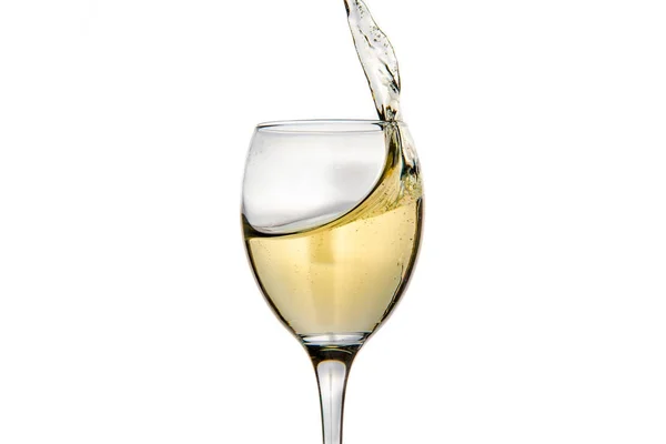 Wineglass with splashing drops of champagne — Stock Photo, Image