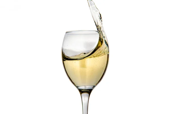 Ποτήρι κρασιού με πιτσίλισμα σταγόνες σαμπάνια — Φωτογραφία Αρχείου