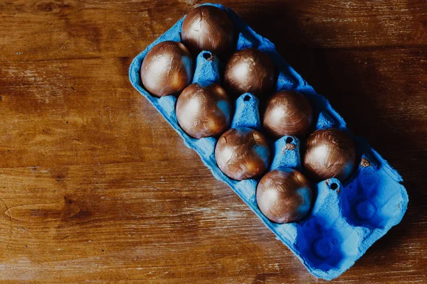 Golden Easter eggs in blue box — Stock Photo, Image