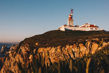 Cabo da Roca Lighthouse and Atlantic Ocean, Portugal clipart