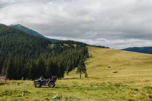 ATV Quad Bike in front of mountains landscape