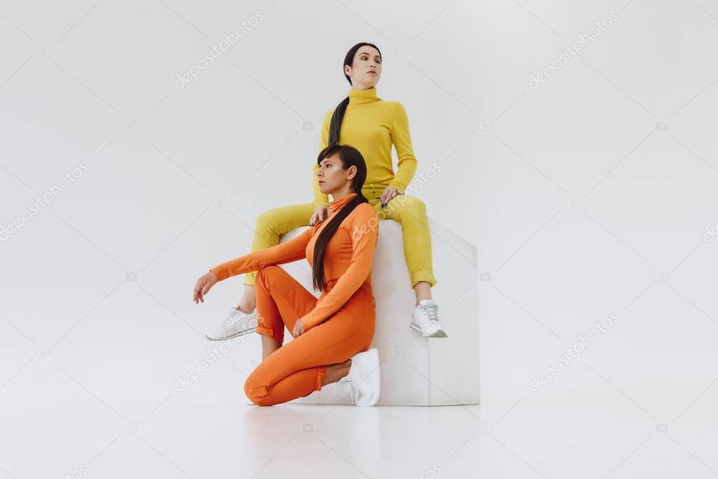 two women on white cube