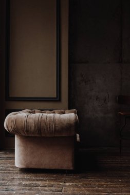 Brown armchair in loft studio