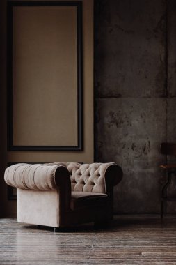 Brown armchair in loft studio