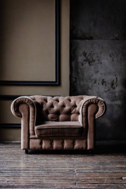 Brown armchair in loft studio