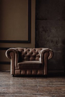 Brown armchair in loft studio