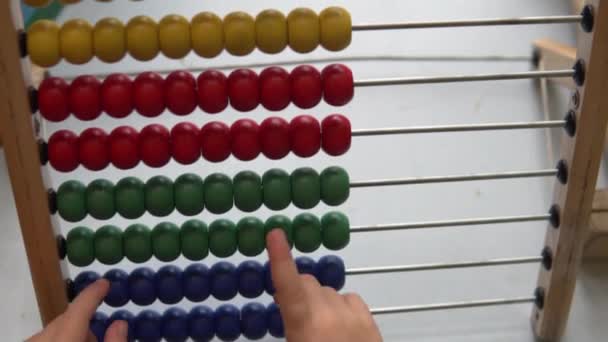 Childrens hand goes over color scores. — Stock Video