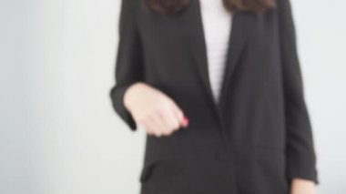 A businesswoman reaches out for a handshake
