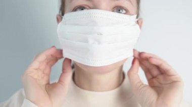 Close-up of a woman in a medical mask