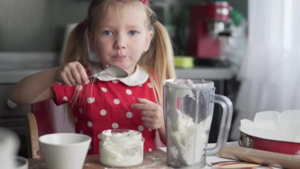 Funny Little Girl Cooks in the Kitchen. — Stock Video