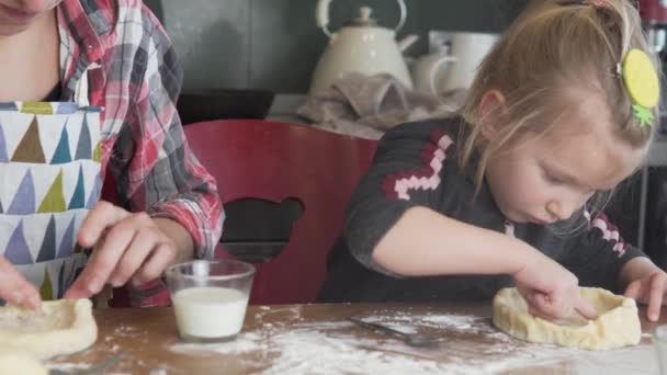 Mom and daughter prepare bread at home in the kitchen during the quarantine — Stock Video