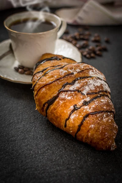 Croissant with chocolate and coffee — Stock Photo, Image