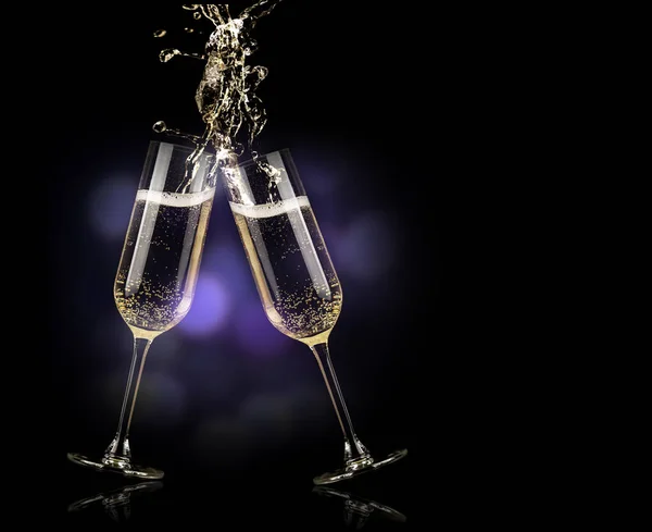 champagne glasses with splash