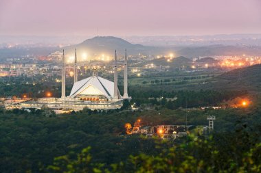 Faisal mosque dominates the landscape of Islamabad clipart