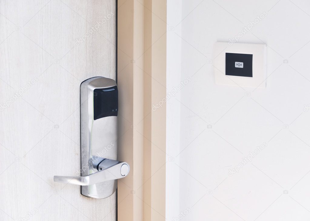 Entrance wood door with electronic keycard lock system and bell button