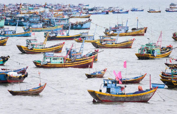 Vietnamese fishing village, Mui Ne, Vietnam, Southeast Asia. Landscape with sea and traditional colorful fishing boats at Muine. Popular landmark and tourist destination of Vietnam.