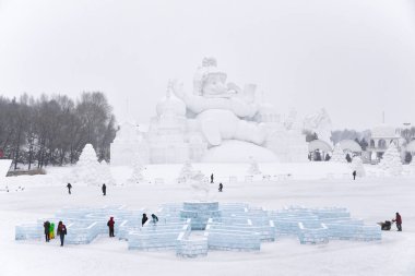 HARBIN, CHINA - JAN 21, 2017: Snow sculptures  China, Harbin Sun Island International Snow Sculpture Art Expo. Located in Harbin City, Heilongjiang, China. clipart