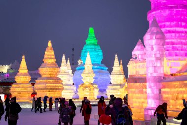 HARBIN, CHINA - JAN 21, 2017: Harbin International Ice and Snow Sculpture Festival is an annual winter festival that takes place in Harbin. It is the world largest ice and snow festival. clipart