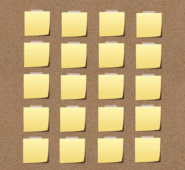 yellow sticky notes on sand board.