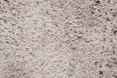 Çakıl ve bej karışımı beton duvar dokusu