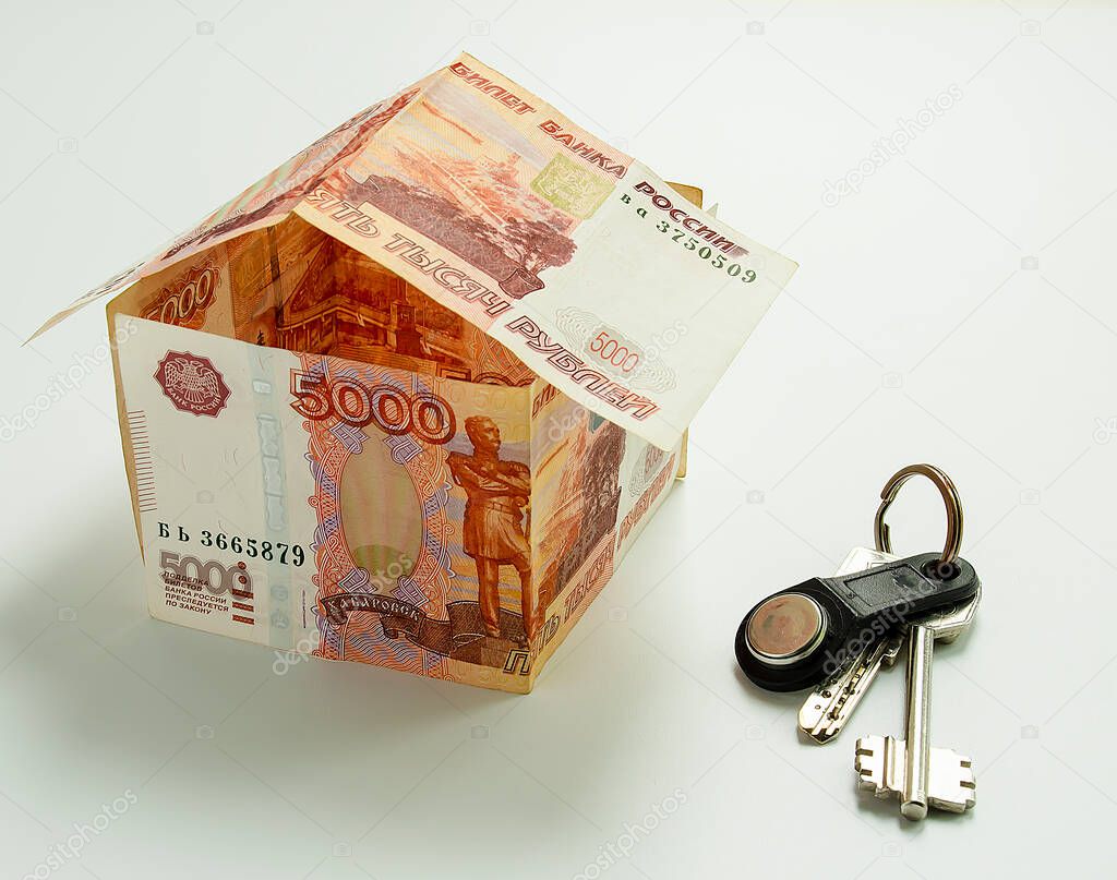 Banknotes Russian rubles, folded in the form of a house and house keys.