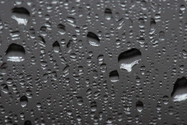 Gotas de água no fundo cinza, vista superior — Fotografia de Stock