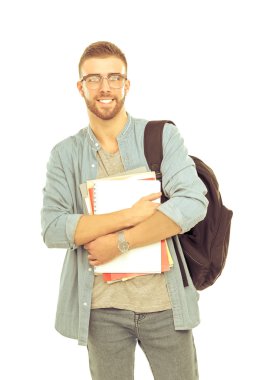 Beyaz arka plan üzerinde izole kitap tutan bir okul çantası olan bir erkek öğrenci